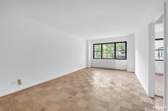 345 E 80th St Unit 5-L, New York City, NY 10075 - unfurnished room with baseboards