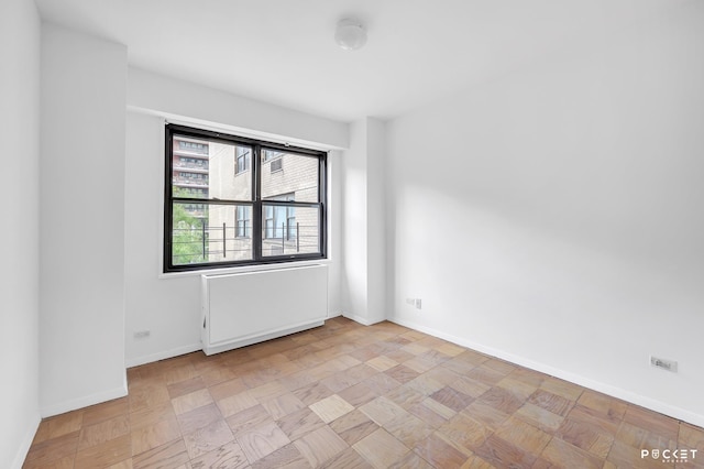 345 E 80th St Unit 5-L, New York City, NY 10075 - spare room featuring baseboards