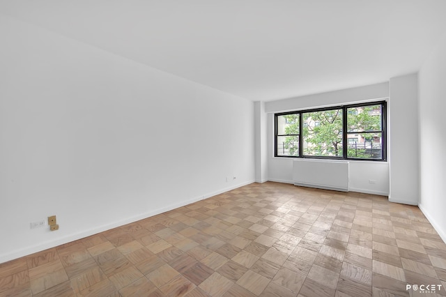 345 E 80th St Unit 5-L, New York City, NY 10075 - unfurnished room featuring baseboards