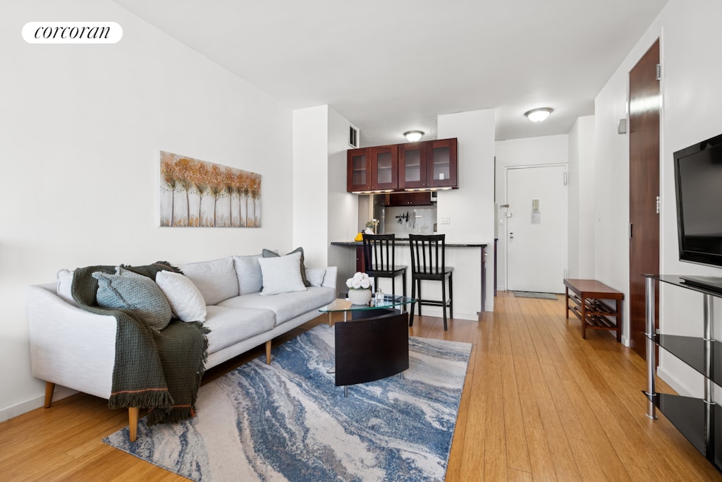 10 W 15th St Unit 1822, New York City, NY 10011 - living area featuring light wood finished floors