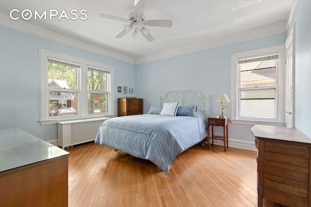 492 Westminster Rd, New York City, NY 11218 - bedroom featuring radiator, light wood-style flooring, crown molding, baseboards, and a ceiling fan