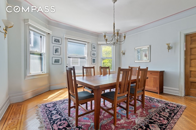 492 Westminster Rd, New York City, NY 11218 - dining room with a chandelier, light wood-style flooring, baseboards, and ornamental molding