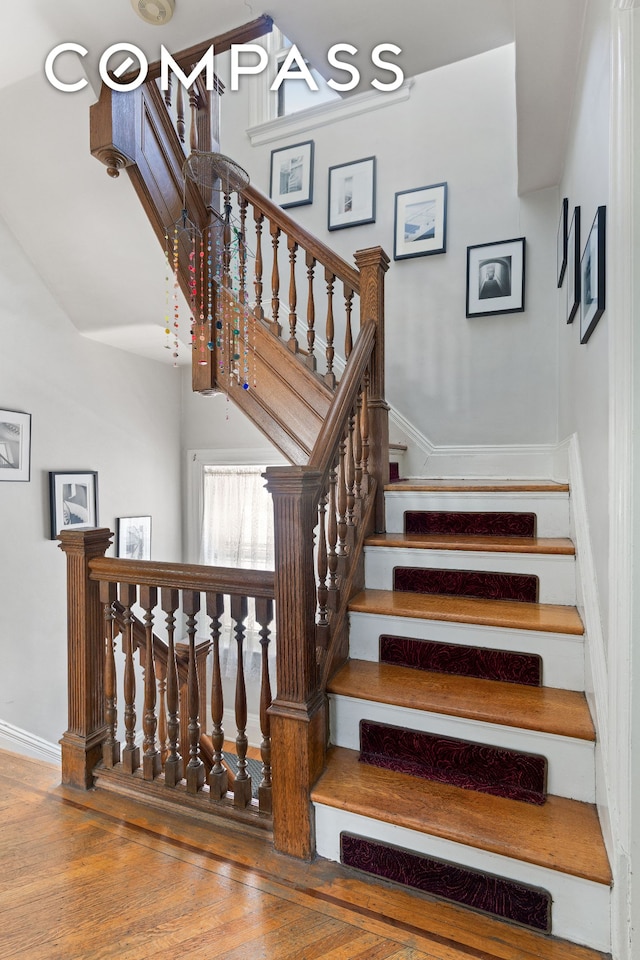 492 Westminster Rd, New York City, NY 11218 - staircase with wood finished floors and baseboards