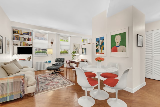 22 Irving Pl Unit 1E, New York City, NY 10003 - dining room featuring radiator and wood finished floors