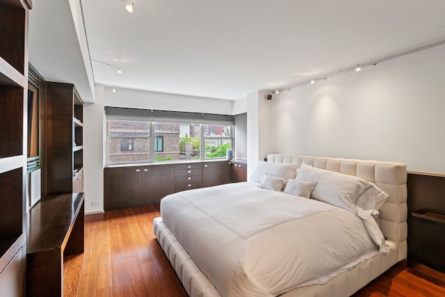 40 E 78th St Unit 7-H, New York City, NY 10075 - bedroom featuring hardwood / wood-style floors and rail lighting
