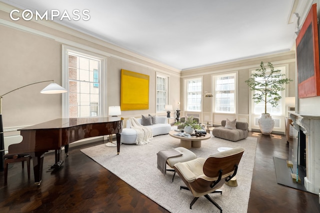 46 E 71st St, New York City, NY 10021 - living area featuring a premium fireplace, crown molding, and healthy amount of natural light