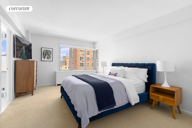 175 W 13th St Unit 14D, New York City, NY 10011 - bedroom with light carpet and baseboards
