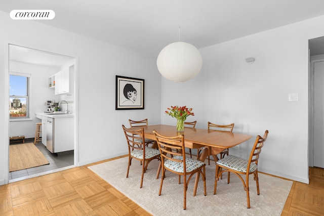 175 W 13th St Unit 14D, New York City, NY 10011 - dining area featuring baseboards