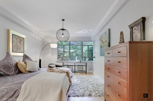 440 E 56th St Unit 1-G, New York City, NY 10022 - bedroom with crown molding and light wood finished floors