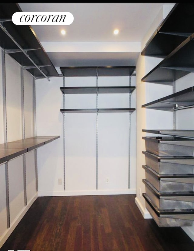 200 E 58th St Unit 17H, New York City, NY 10022 - walk in closet featuring dark wood-style flooring