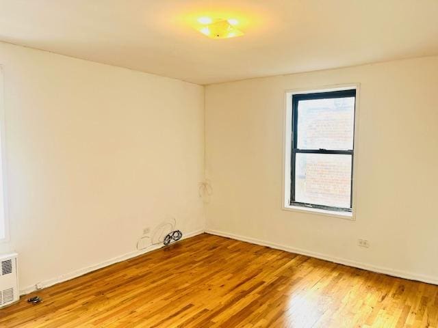 3500 Snyder Ave Unit 3R, New York City, NY 11203 - spare room with light wood finished floors, baseboards, and radiator heating unit