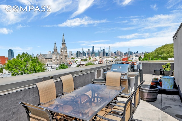 36 Russell St Unit 22, New York City, NY 11222 - view of patio / terrace featuring a skyline view, a grill, and outdoor dining area