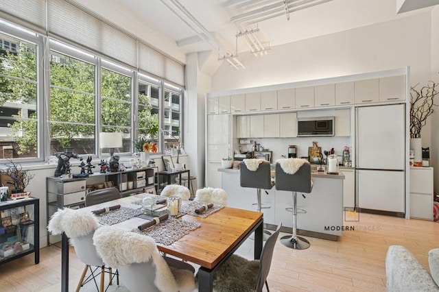 27-28 Thomson Ave Unit 135, New York City, NY 11101 - dining room featuring light wood-style flooring and rail lighting