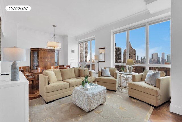 351 E 51st St Unit Ph7A, New York City, NY 10022 - living area featuring crown molding and a skyline view