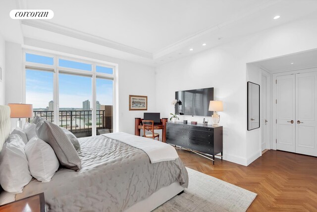 351 E 51st St Unit Ph7A, New York City, NY 10022 - bedroom with recessed lighting, access to exterior, and a raised ceiling