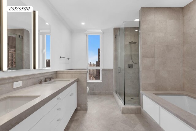 351 E 51st St Unit Ph7A, New York City, NY 10022 - full bath featuring tile walls, a shower stall, a bath, double vanity, and tile patterned flooring