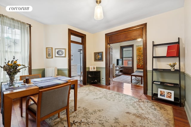 224 E 11th St Unit 20, New York City, NY 10003 - home office featuring radiator and wood finished floors