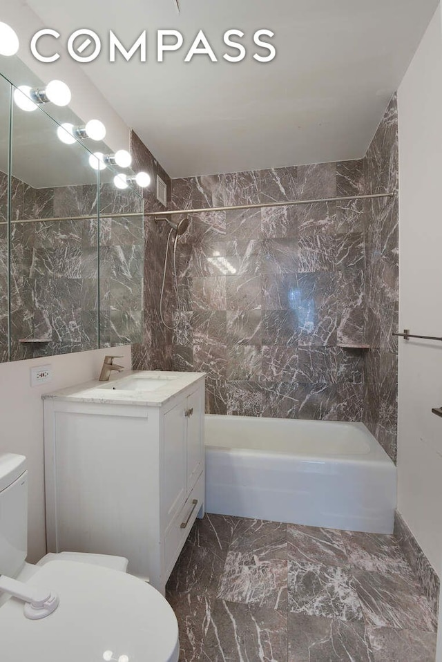 201 E 80th St Unit 16E, New York City, NY 10075 - bathroom with toilet, vanity, shower / bathtub combination, and marble finish flooring