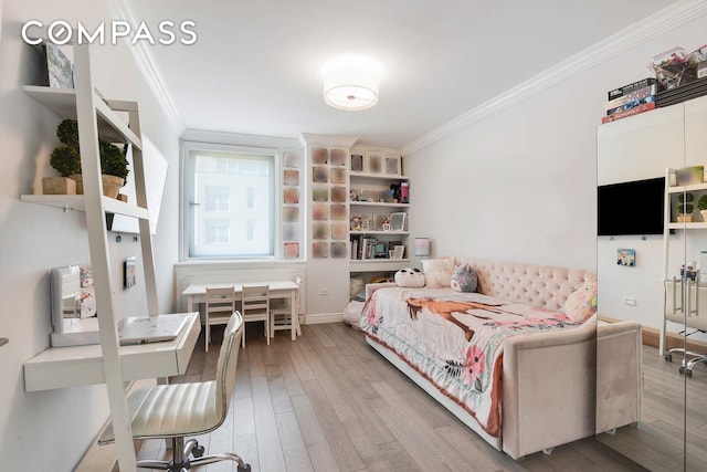 201 E 80th St Unit 16E, New York City, NY 10075 - bedroom featuring ornamental molding, wood finished floors, and baseboards