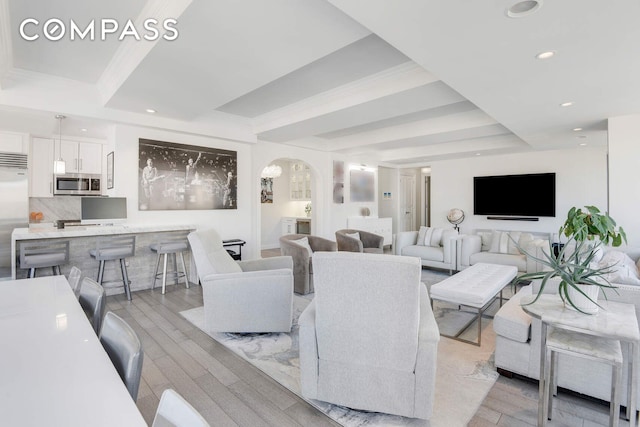 201 E 80th St Unit 16E, New York City, NY 10075 - living area featuring arched walkways, light wood finished floors, and recessed lighting