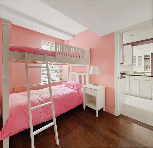 200 E 66th St Unit E307, New York City, NY 10065 - bedroom featuring wood finished floors, baseboards, and connected bathroom