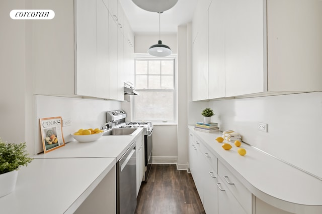 125 E 74th St Unit 2B, New York City, NY 10021 - kitchen featuring stainless steel dishwasher, electric stove, light countertops, and dark wood finished floors