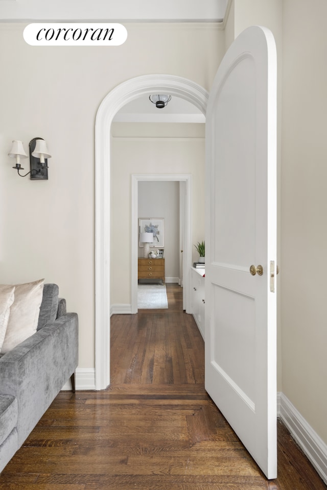 125 E 74th St Unit 2B, New York City, NY 10021 - corridor with arched walkways, wood finished floors, and baseboards