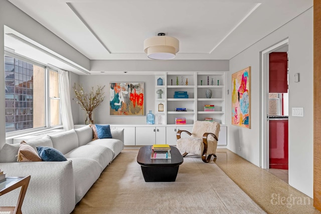 118 E 60th St Unit 33/32Duplex, New York City, NY 10022 - living room with speckled floor, a tray ceiling, and built in features