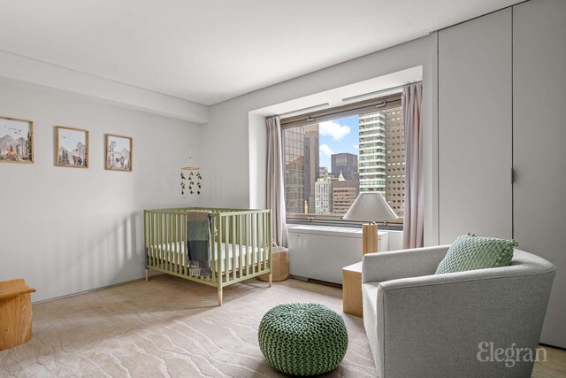 118 E 60th St Unit 33/32Duplex, New York City, NY 10022 - bedroom featuring a nursery area and a view of city