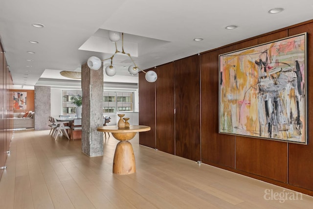 118 E 60th St Unit 33/32Duplex, New York City, NY 10022 - dining room featuring wooden walls, recessed lighting, and light wood finished floors