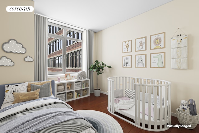 1485 5th Ave Unit 19C, New York City, NY 10035 - bedroom featuring multiple windows, baseboards, and wood finished floors