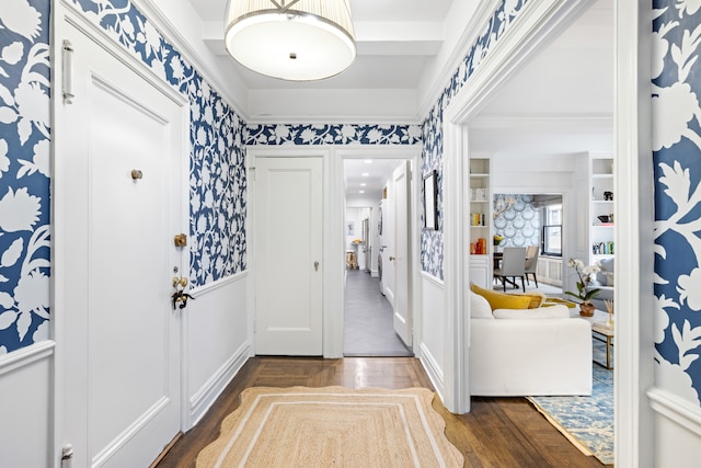 45 E 85th St Unit 7E, New York City, NY 10028 - foyer featuring wainscoting, wallpapered walls, a decorative wall, and dark wood-style flooring