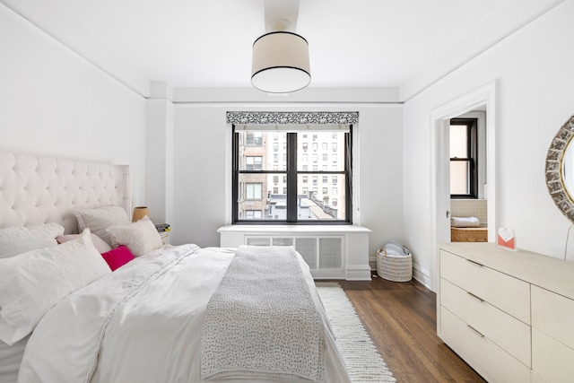 45 E 85th St Unit 7E, New York City, NY 10028 - bedroom featuring dark wood-style floors, radiator heating unit, and baseboards