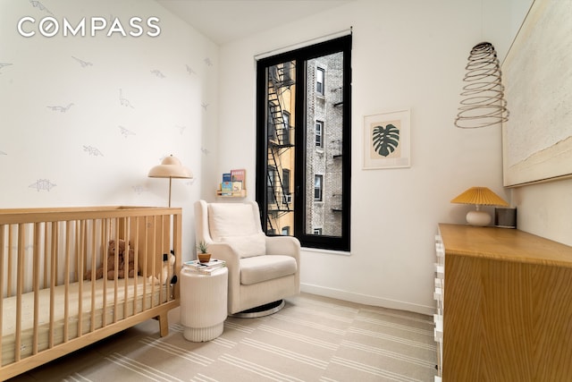 856 Washington Ave Unit 5A, New York City, NY 11238 - carpeted bedroom with a nursery area and baseboards