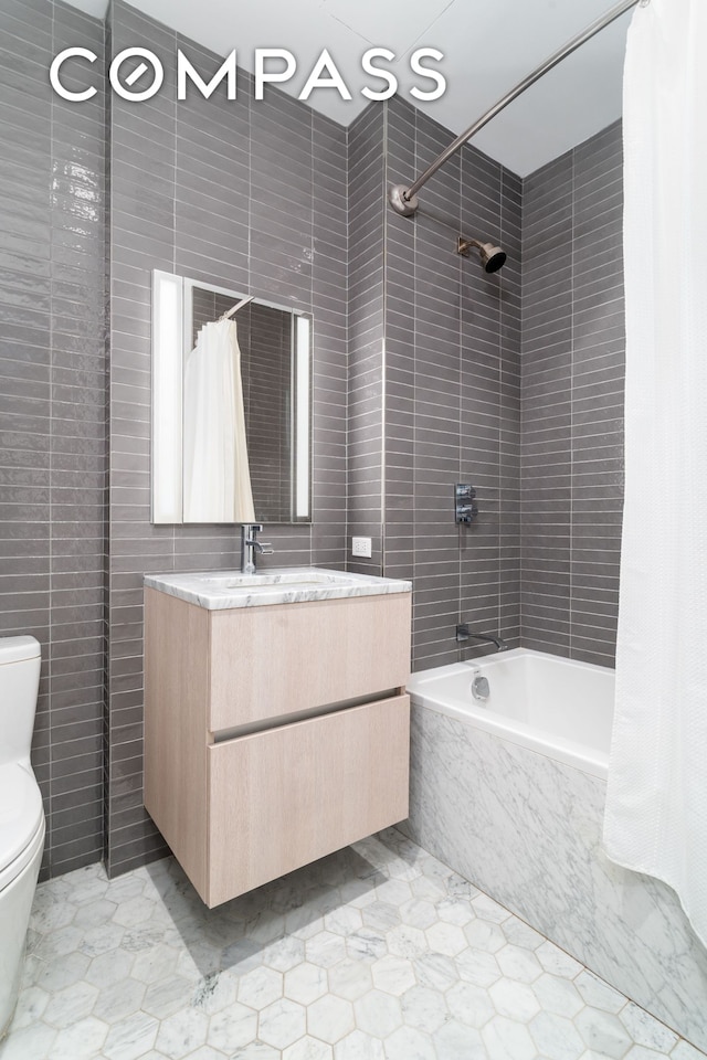 856 Washington Ave Unit 5A, New York City, NY 11238 - full bathroom with toilet, tiled shower / bath combo, vanity, tile walls, and tile patterned flooring