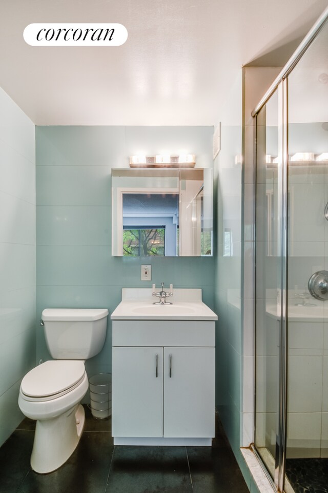 333 E 119th St Unit 1A, New York City, NY 10035 - bathroom with vanity, toilet, and a stall shower