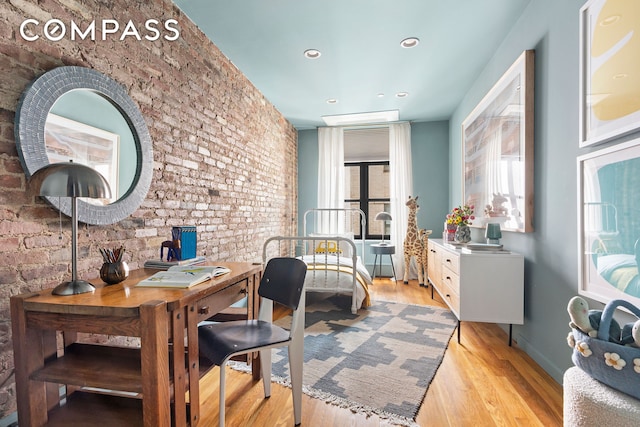 120 W 20th St Ph, Ph, New York City, NY 10011 - home office with brick wall, light wood-type flooring, and recessed lighting