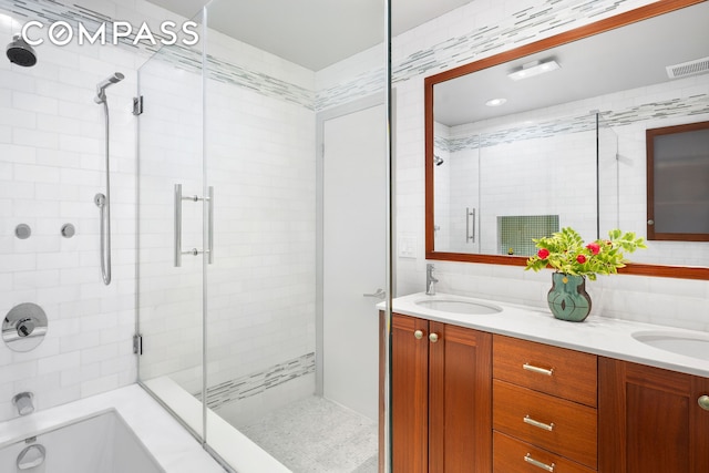 120 W 20th St Ph, Ph, New York City, NY 10011 - full bath with tiled shower, double vanity, a bathtub, and decorative backsplash
