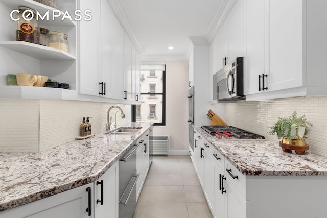 905 W End Ave Unit 81, New York City, NY 10025 - kitchen with stainless steel appliances, a sink, open shelves, tasteful backsplash, and ornamental molding