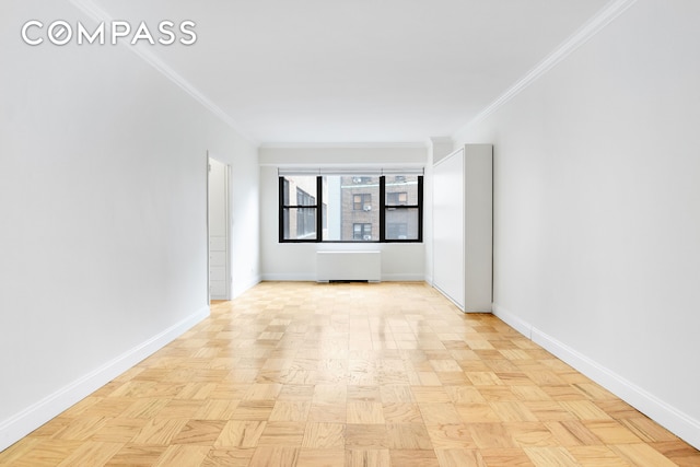 305 E 40th St Unit 14V, New York City, NY 10016 - empty room with radiator heating unit and ornamental molding