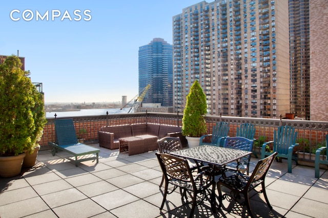 305 E 40th St Unit 14V, New York City, NY 10016 - view of patio / terrace featuring outdoor lounge area and a water view
