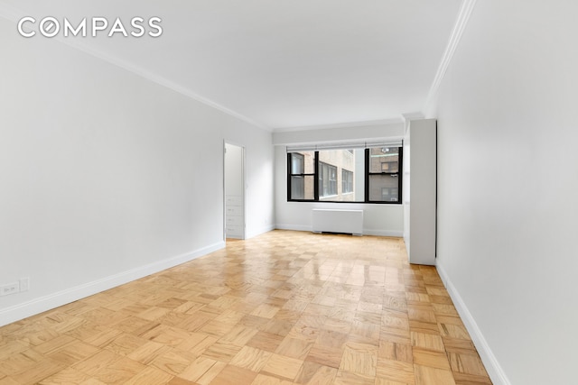 305 E 40th St Unit 14V, New York City, NY 10016 - empty room featuring radiator and ornamental molding