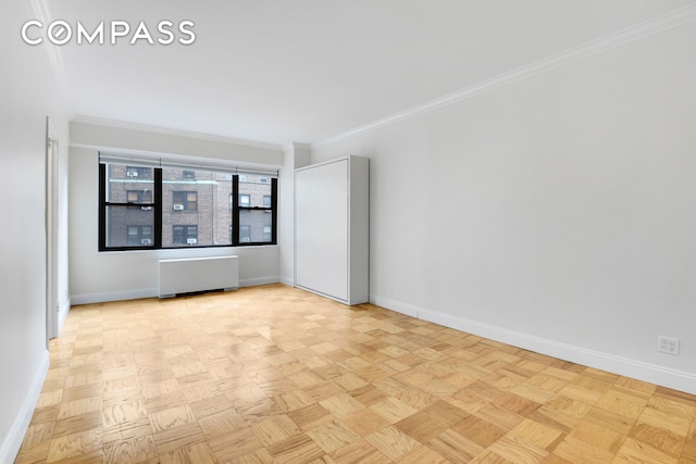 305 E 40th St Unit 14V, New York City, NY 10016 - unfurnished room featuring radiator and ornamental molding