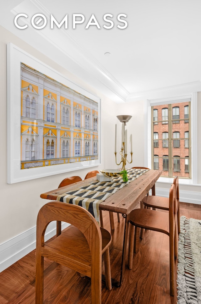 140 E 63rd St Unit 9B, New York City, NY 10065 - dining space featuring wood finished floors, baseboards, and crown molding