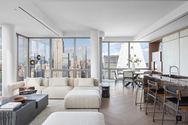 23 E 22nd St Unit 55, New York City, NY 10010 - living area featuring a view of skyline and floor to ceiling windows