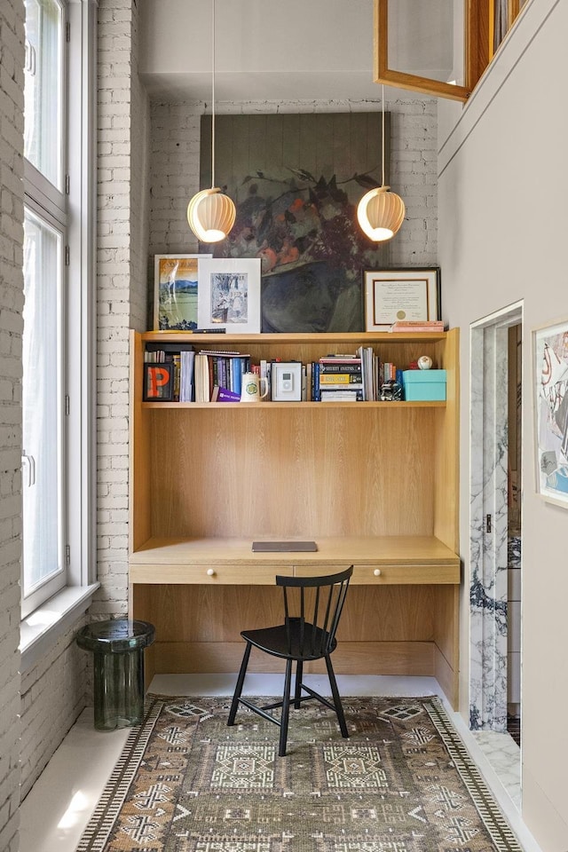 132 Greene St Unit 3R, New York City, NY 10012 - office area featuring brick wall