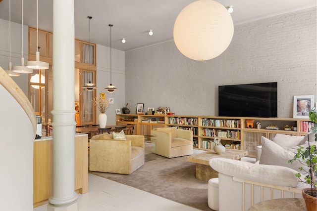 132 Greene St Unit 3R, New York City, NY 10012 - living room with ornate columns and carpet floors