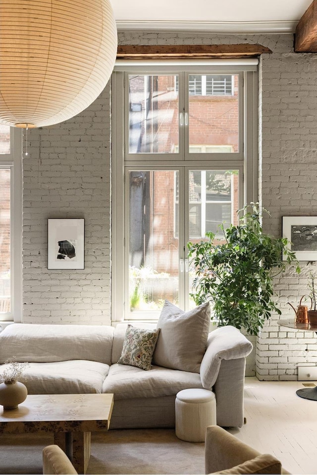 132 Greene St Unit 3R, New York City, NY 10012 - living room with brick wall