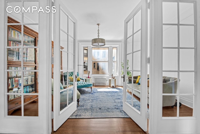 800 Riverside Dr Unit 2E, New York City, NY 10032 - foyer entrance with wood finished floors, radiator heating unit, and french doors