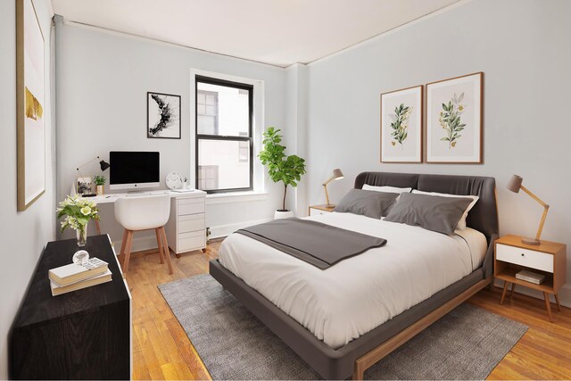 240 E 24th St Unit 2H, New York City, NY 10010 - bedroom featuring light wood-type flooring and an office area